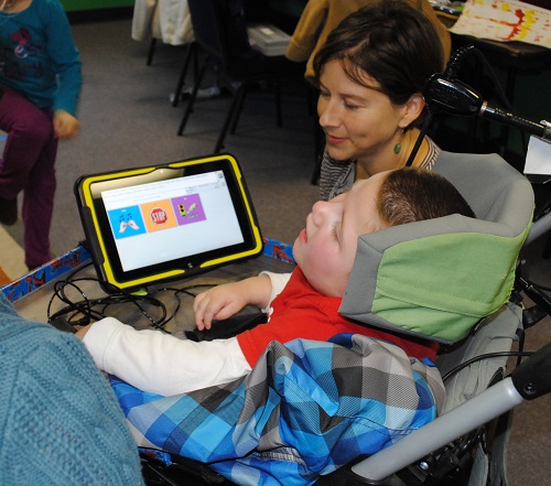 photo of a PRC consultant with a young child using CoreScanner